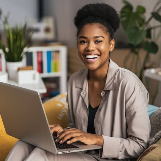 woman on laptop studying how to become a millionaire